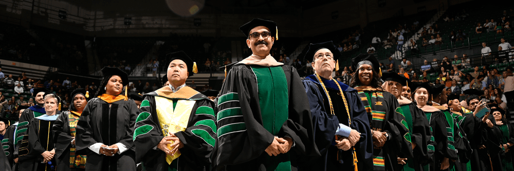 UNC Charlotte DBA graduates with faculty members